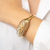 Terrarium Bangle in 18K Gold with diamonds mother of pearl and rock crystal wear on
